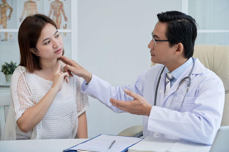 Shot of a doctor assessing a patient for chronic neck pain